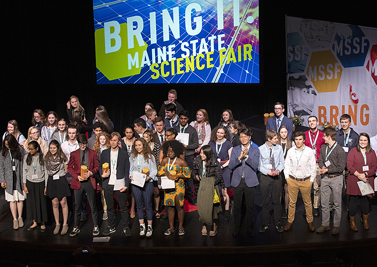 Students on stage at awards ceremony